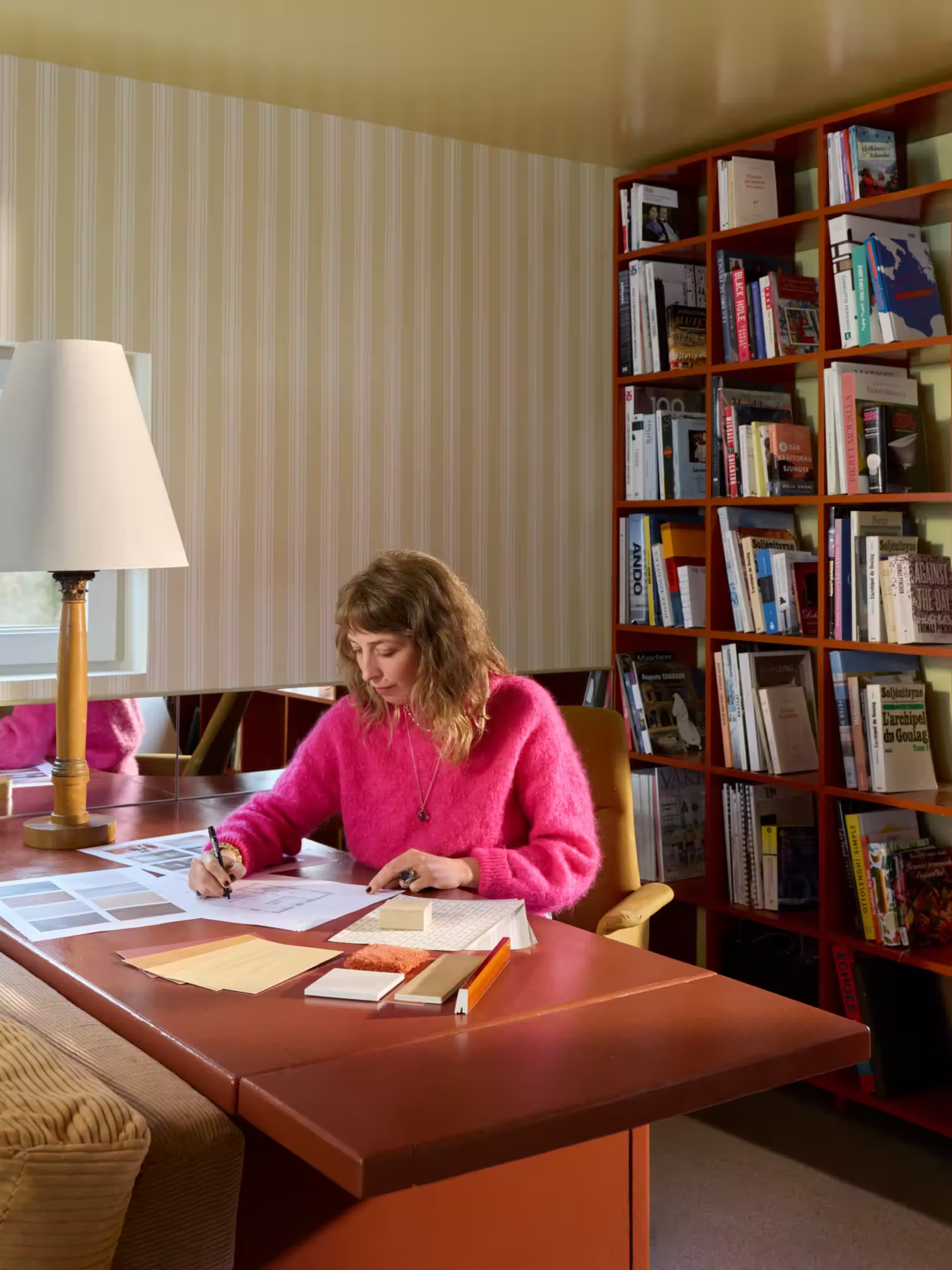 Camille Daher interior designer working in her home office in Stockholm